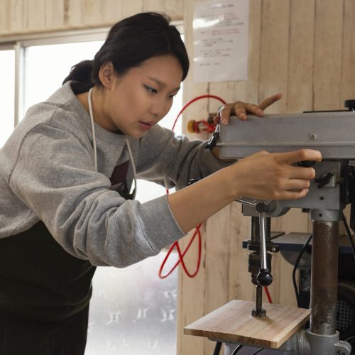 asian-woman-working-with-wood asian-woman-working-with-wood